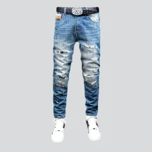 Small skulls embroidery jeans
 for men